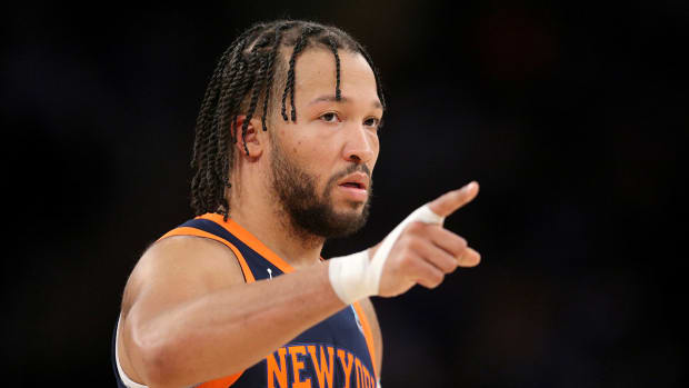 New York Knicks guard Jalen Brunson (11) points during the second quarter against the Detroit Pistons at Madison Square Garden.